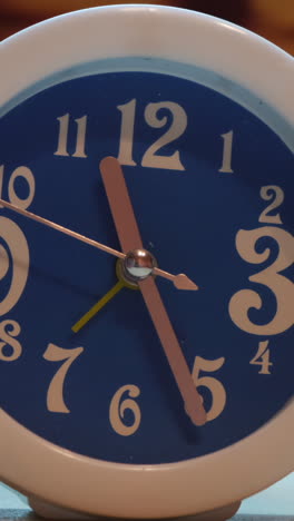 close-up of a blue and white table clock