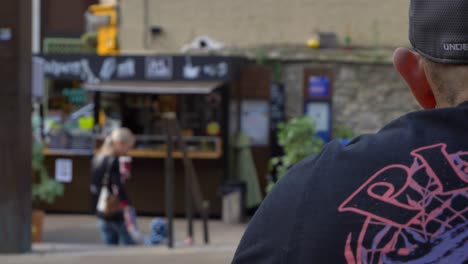 Over-the-Shoulder-Shot-of-Young-Family-In-Background-of-Bonn-Square-Oxford-01