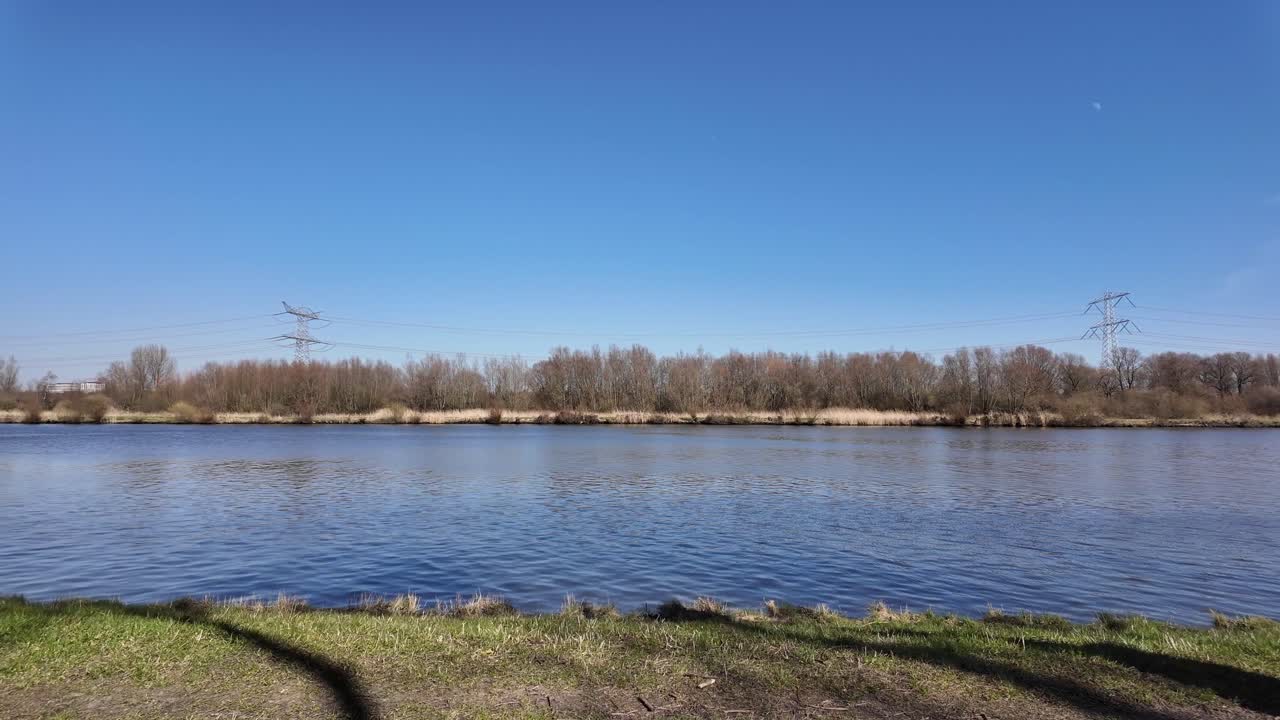 Cycling next to the river in nature on a sunny day
