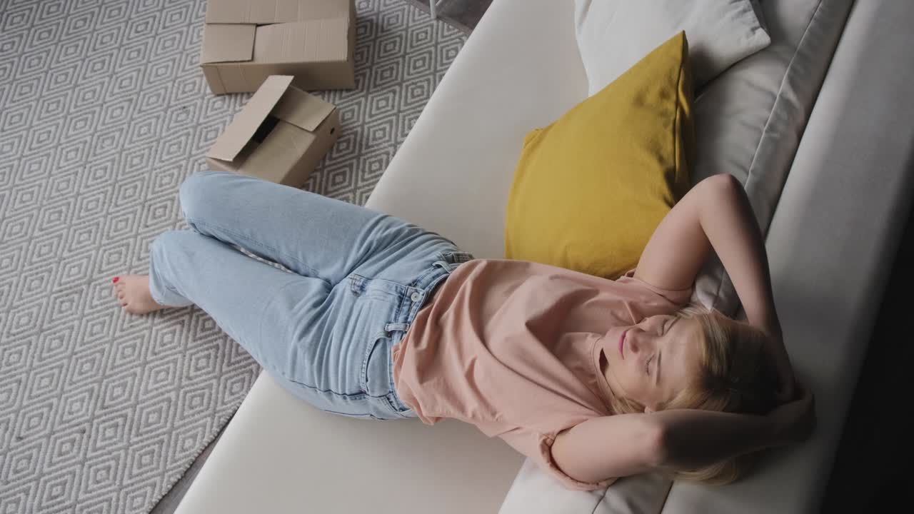 Young woman celebrates moving into a new apartment.