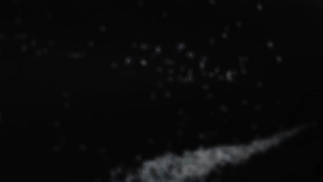 white basmati rice seeds bouncing against camera black background. pile of rice grains flies in slow motion