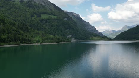 Aerial-view-of-tranquil-lake-with-mountain-backdrop-creating-calm-scene