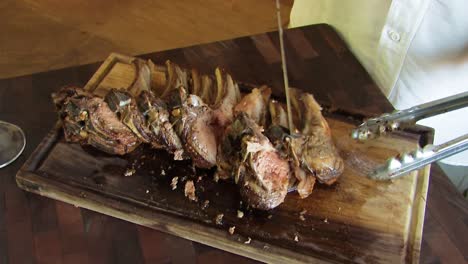 rack of lamb resting on chopping board