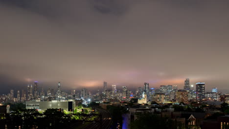 sweeping low clouds over the chicago skyline on a summer storm filled night - tight crop