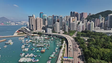 an aerial view of a city with boats in the water