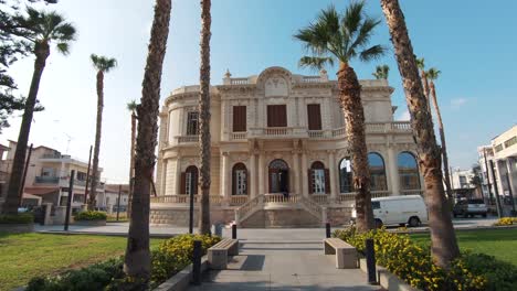 Establishing-view-of-Limassol-Municipal-University-Library-on-a-clear-summer-day,-Cyprus---Wide-push-in-Gimbal-shot