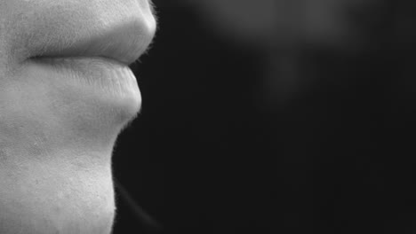 a woman smokes an electronic cigarette