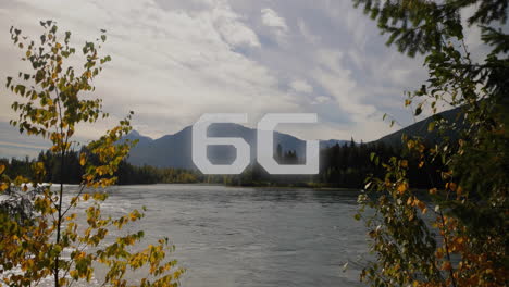 6g animation over scenic river landscape with mountains and trees in background