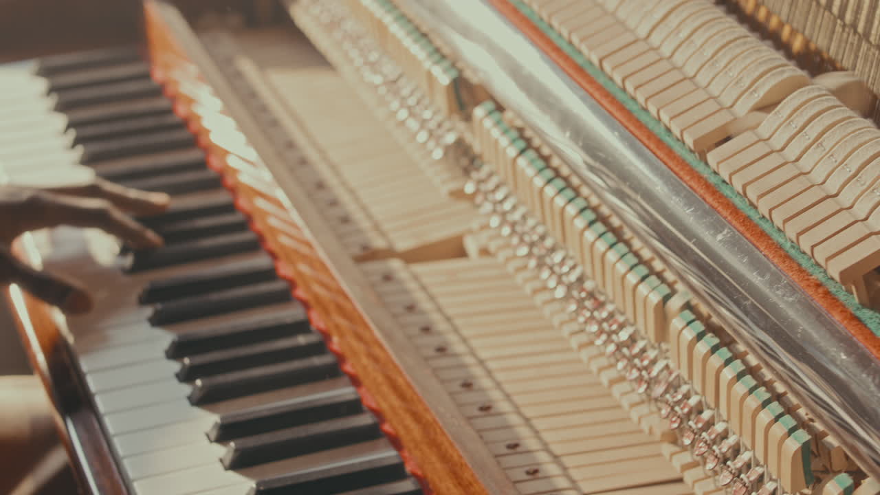 Person playing vintage piano