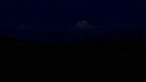 time lapse of day turning into night with colorful clouds in a typical dutch rural location