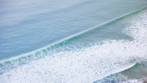 aerial view of waves rolling in