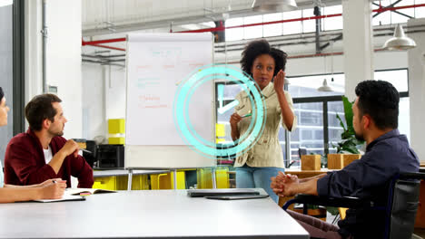 Animation-of-clock-over-african-american-woman-making-presentation-to-business-colleagues