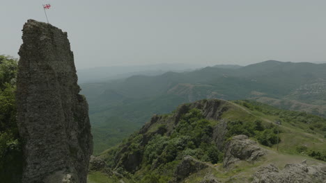 revealing shot of the medieval azeula fortress and a fluttering georgian flag