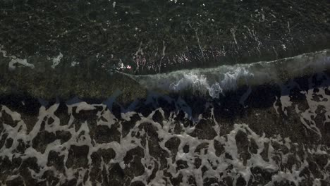 slow motion of ocean waves breaking on shoreline