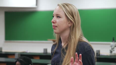 shocked and emotional reaction from young college student in a geology classroom