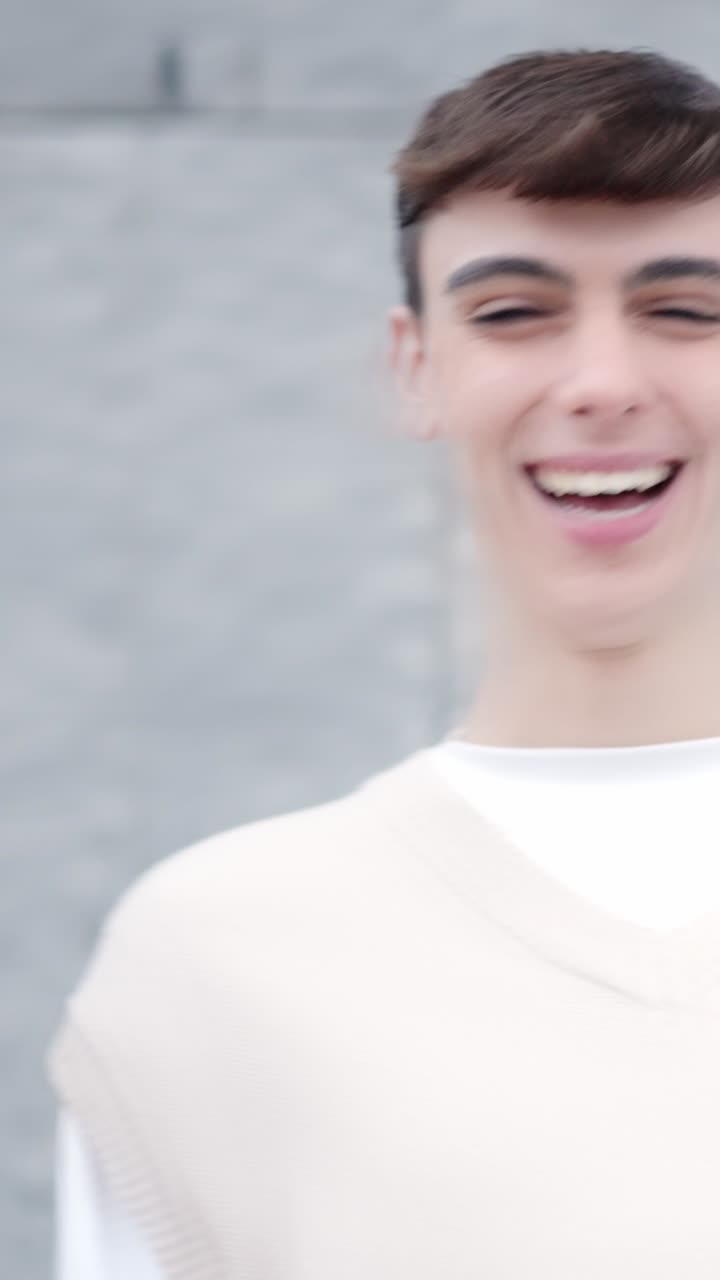 Happy friends laughing standing in the street