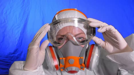 scientist virologist in respirator. woman close up look, wearing protective medical mask. concept health safety n1h1 coronavirus epidemic 2019 ncov.