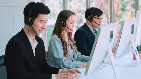 Business-people-wearing-headset-working-in-office