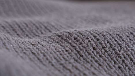 brown wool ribbing or stockinette stitch knitting work slow tilt 4k 2160p 30fps ultrahd footage - close-up of warm sweater details and knitwork 3840x2160 uhd tilting video