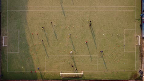 AERIAL---People-playing-footbal,-soccer,-Buenos-Aires,-Argentina,-top-down-view