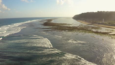 Pantai-Pandawa-Beach,-Bali-Indonesia-fly-over-beautiful-beach-and-amazing-exotic-ocean-in-sunset-golden-hour-in-4k