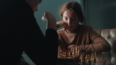 mother and son connect through a game of chess