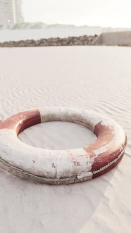 a life preserver on a sandy beach