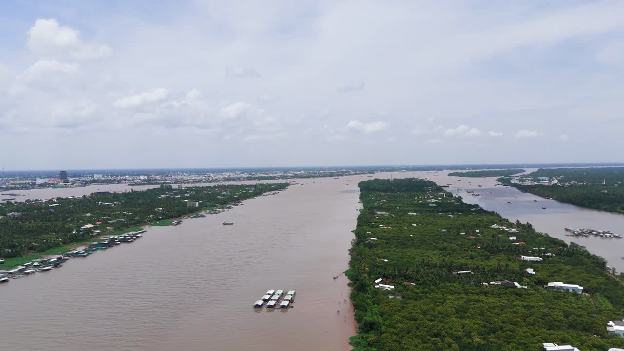 Aerial View Tilt of Houses on the River in Ben Tre.