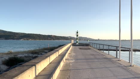 Push-in-shot-of-Lighthouse-in-Setubal,-Portugal-during-sunset