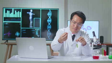 young asian male research scientist talks into camera