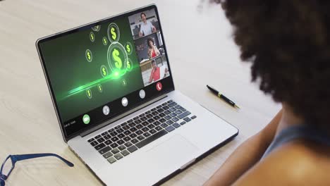 African-american-businesswoman-using-laptop-for-video-call-with-diverse-business-colleagues