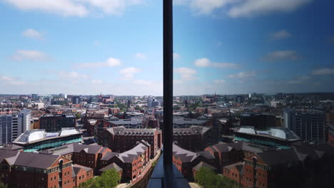 time lapse of leeds city centre skyline on sunny summer’s day with fast moving white clouds - reflections from high rise building’s window