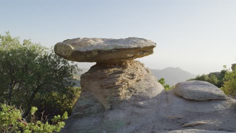 tall standing flat rock natural table on top of hill