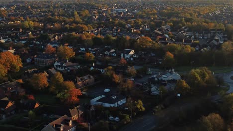 british townhouse neighbourhood aerial view looking down over early morning sunrise autumn coloured rooftops