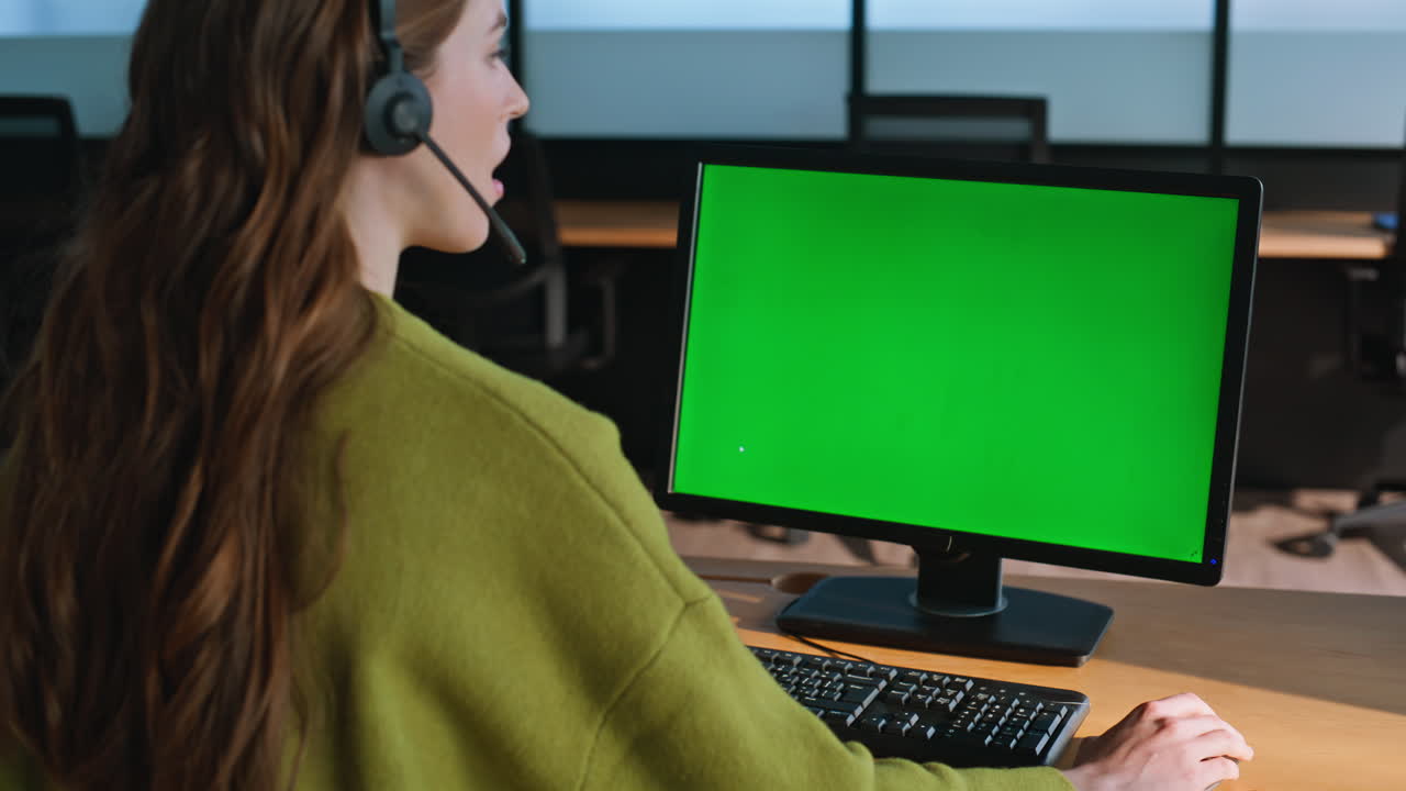 Call operator using mockup computer closeup. Woman manager looking green screen