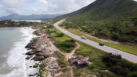 Scenic-bus-ride-along-the-taguantar-coastline,-a-breathtaking-journey-through-lush-mountains-and-beaches