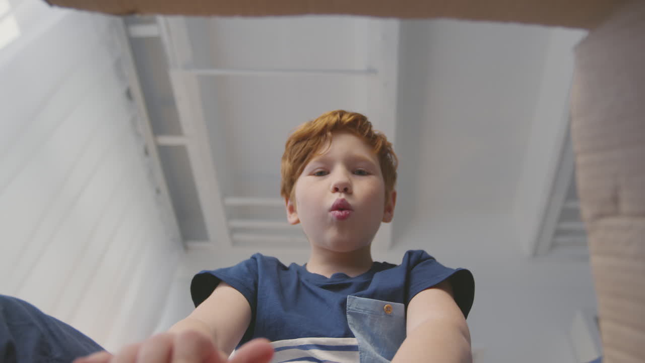 Boy Opening a Gift Box
