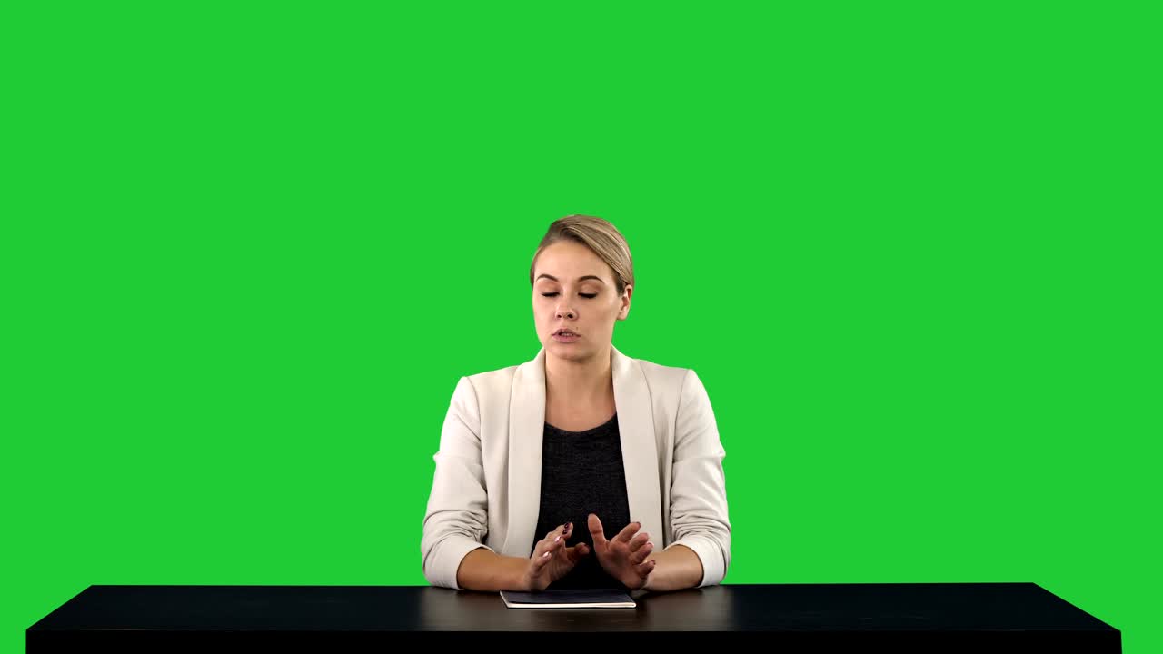 A female newsreader presenting the news, add your own text or image screen behind her on a Green Screen, Chroma Key