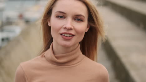 smiling woman walking outdoors.