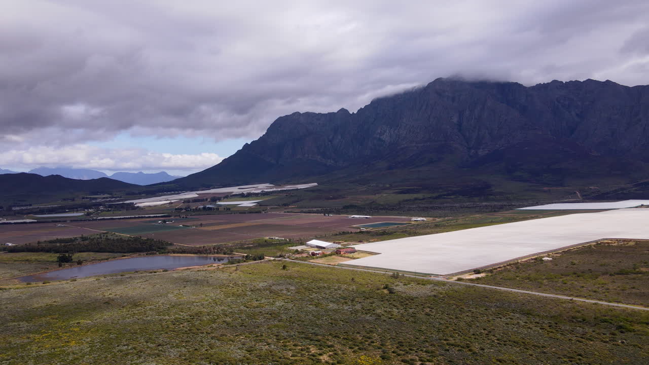 Vast areas under white netting to protect crops on farms in Breede Valley, drone