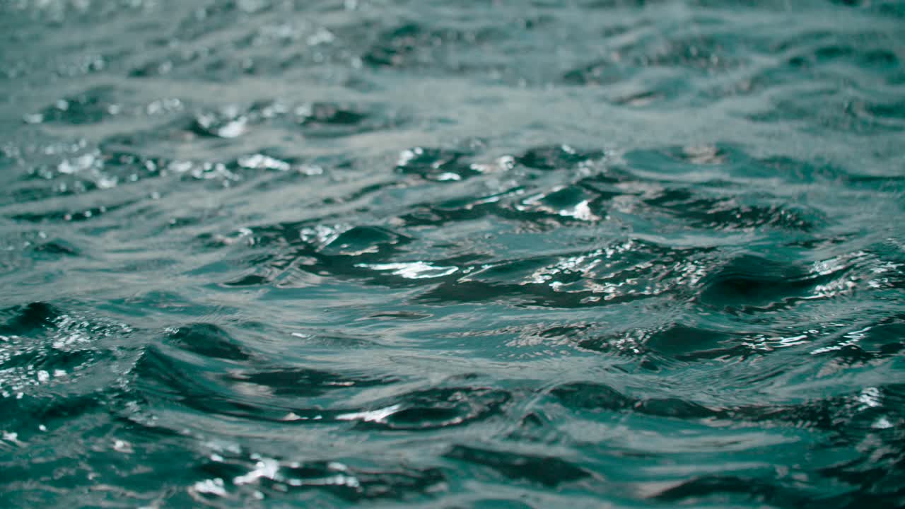 Slow motion cool calm shimmering fluid ocean rippling waves gentle rolling