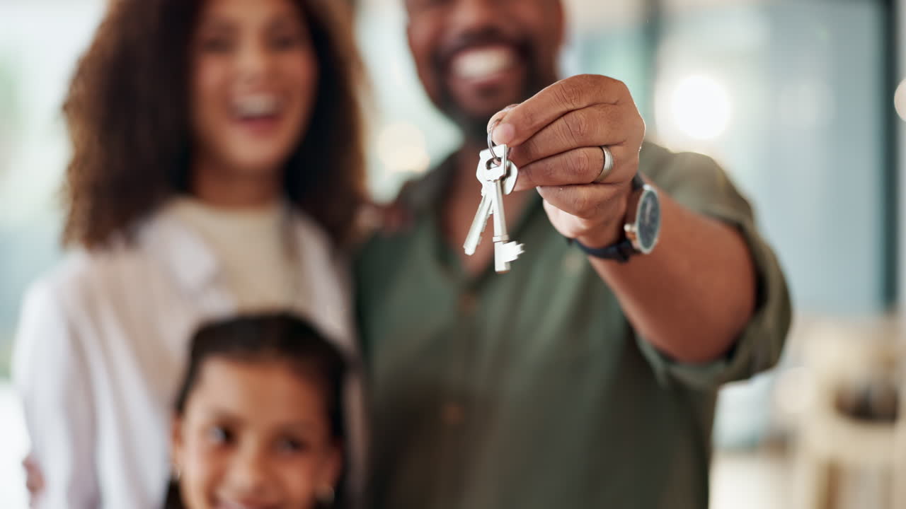 Happy family with keys to new home
