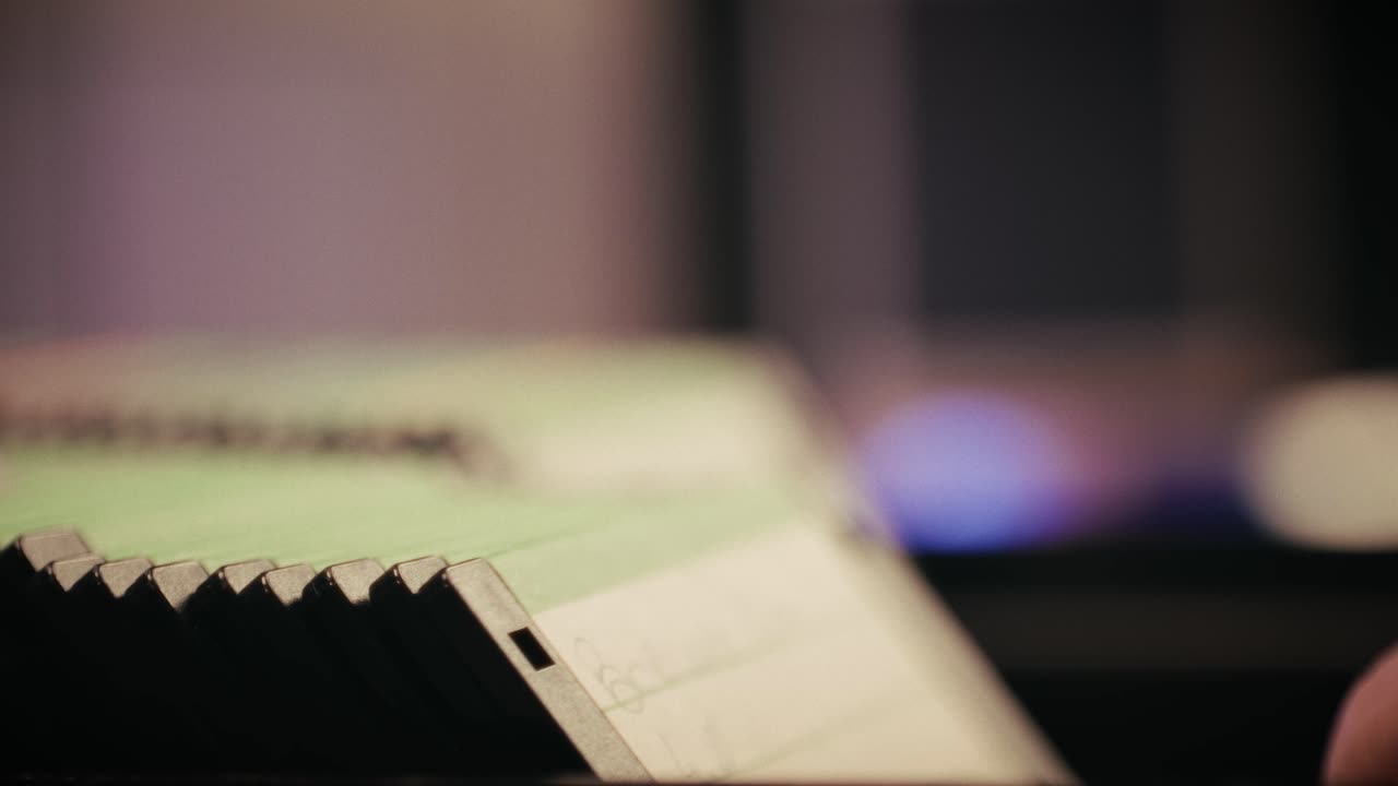 Using diskette for old computer. Music recorder, playing retro computer games. Vintage device for office, obsolete technology. . High quality 4k footage