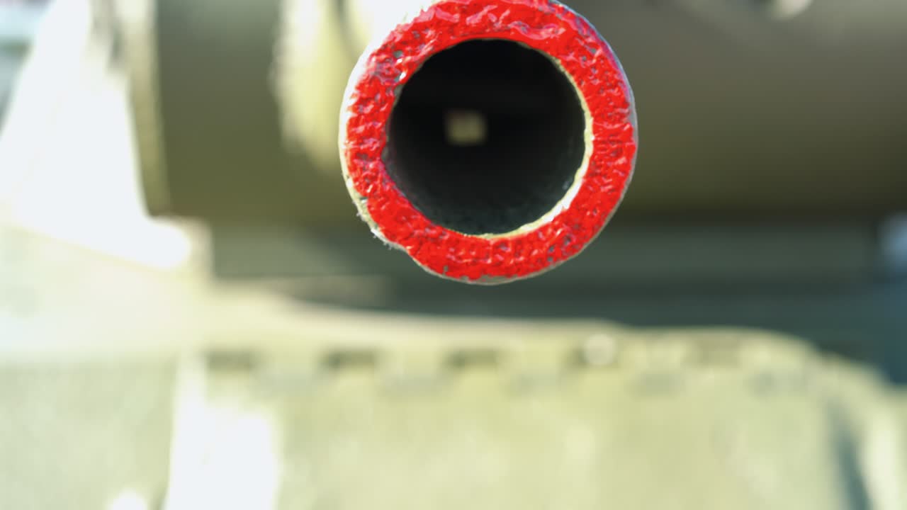 Gun barrel of a tank. Tank gun barrel close-up.