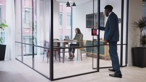 Businesswoman-Shaking-Hands-With-Male-Candidate-In-Meeting-Room-As-He-Arrives-For-Job-Interview