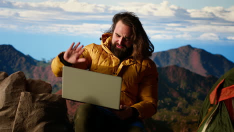 mountain adventurer prioritizes his online business over safety