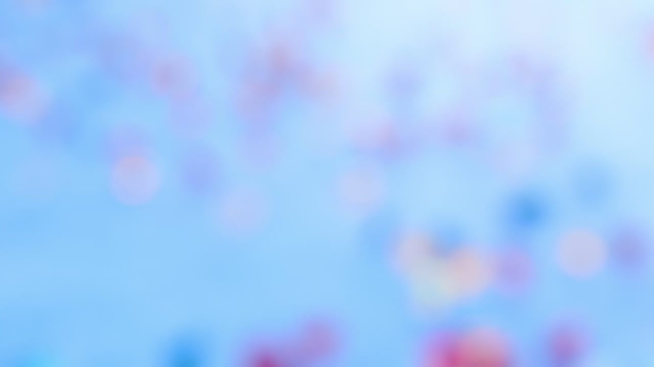 밝은 파란색 배경에 다채로운 보케