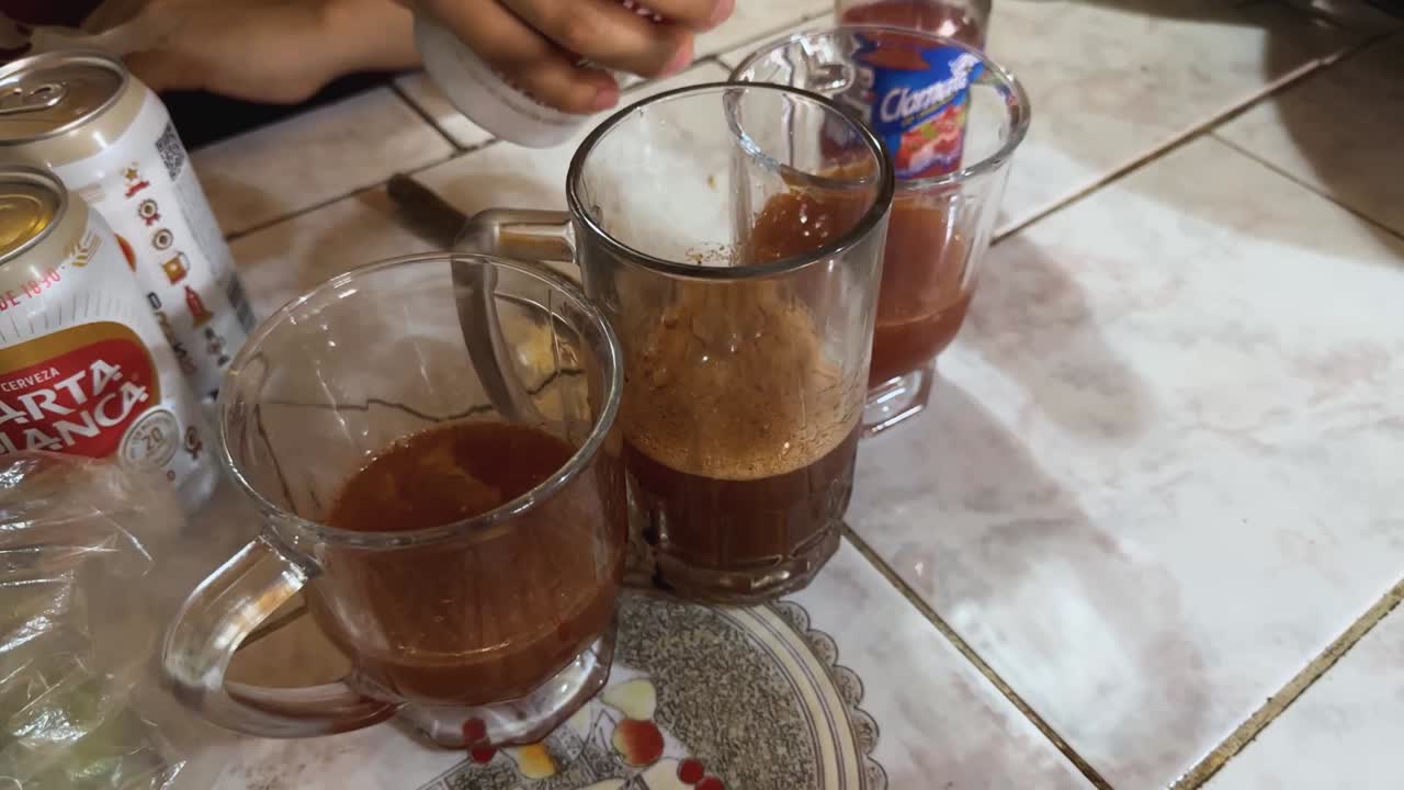 Beer-based Micheladas with lime and sauces, served in traditional Mexican jars