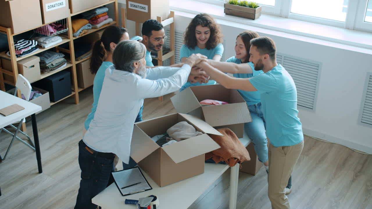 Happy Volunteers Celebrating a Successful Donation Drive