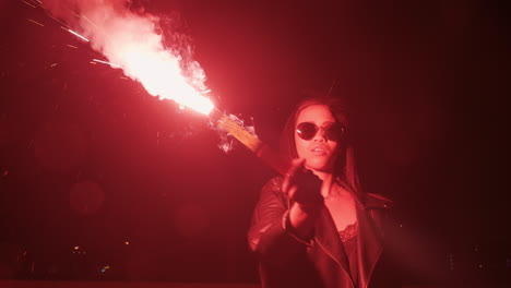 independent woman holding flare in city at night rebellious girl protesting for equality in street with firework female millennial freedom movement